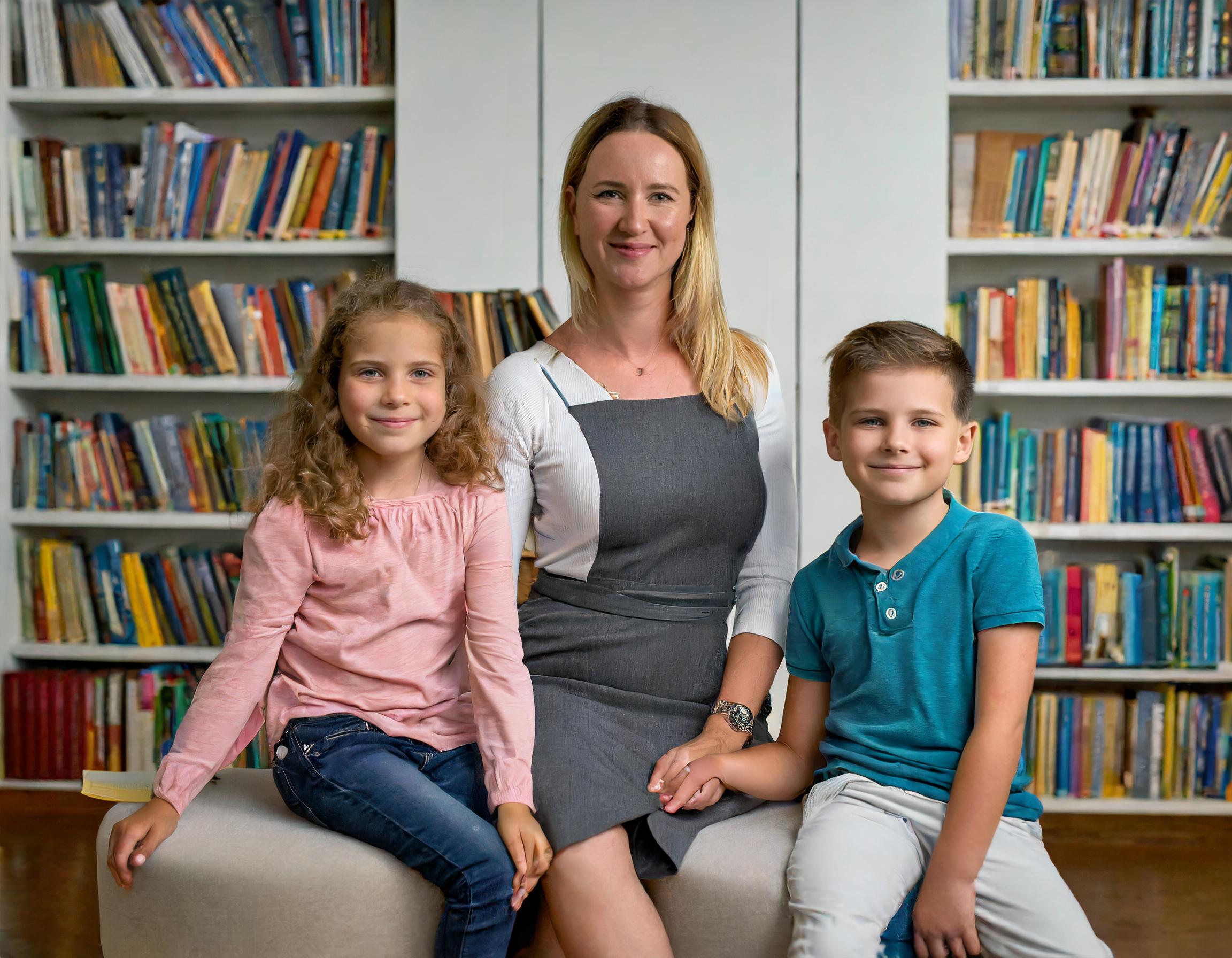 A mom in a Family Safe Library with her children